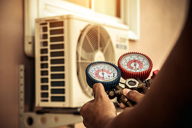 Professional Air Conditioning Service technician working in Vaiden, MS